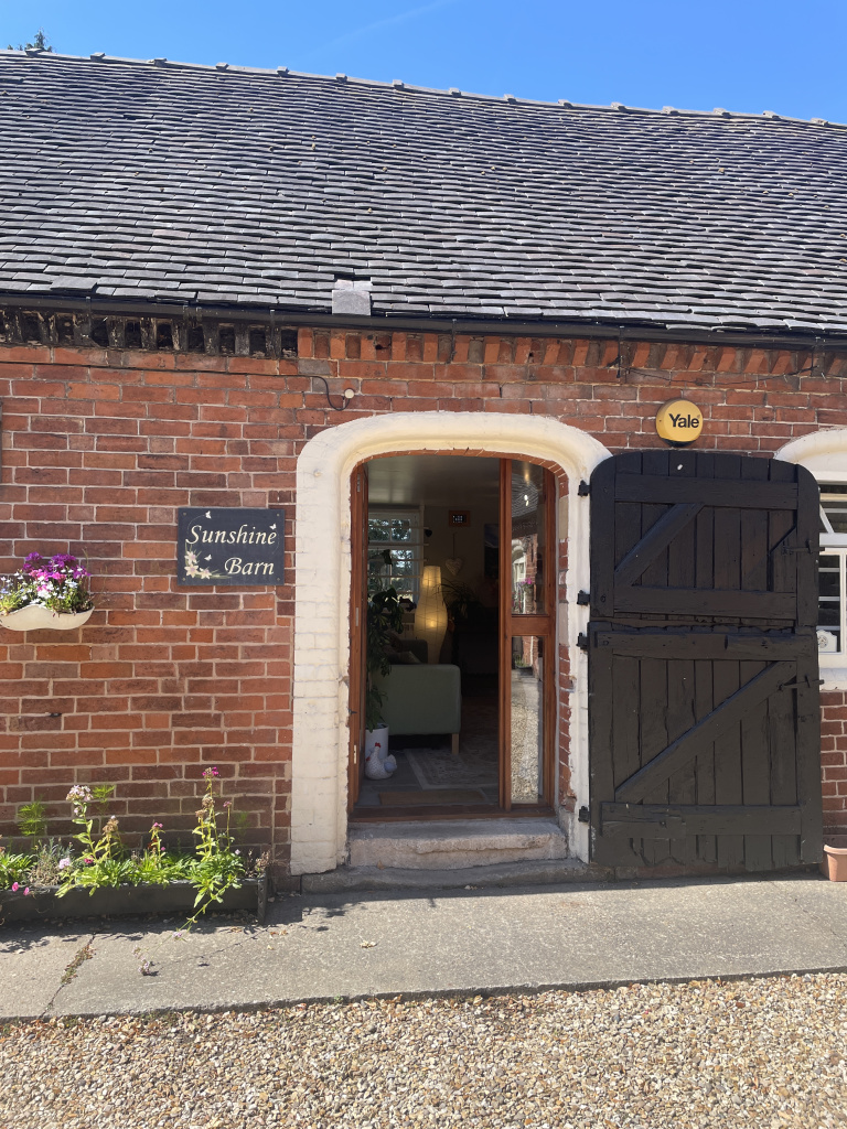 Open door into cosy therapy room symbolising change and new beginnings